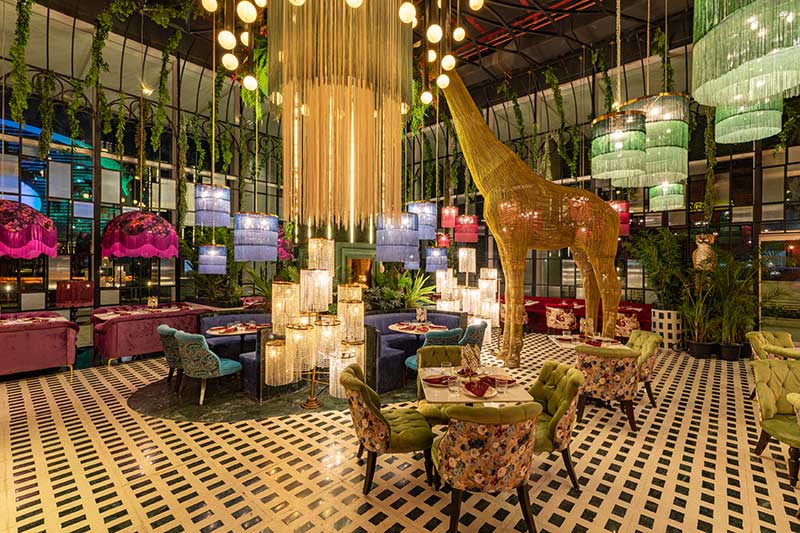 Amazonia luxury restaurant interior with rainforest decor and elegant fine dining setup in Bandra Kurla Complex, Mumbai